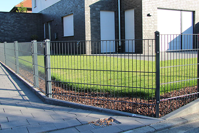 Double rod mat fence as a boundary of the property.